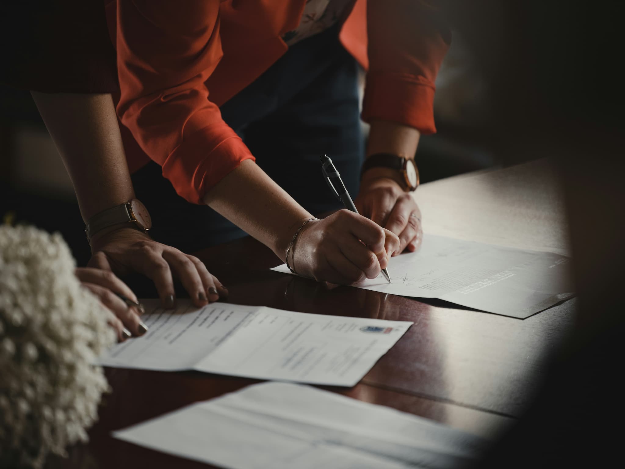 Person completing paperwork related to accommodation application and availability