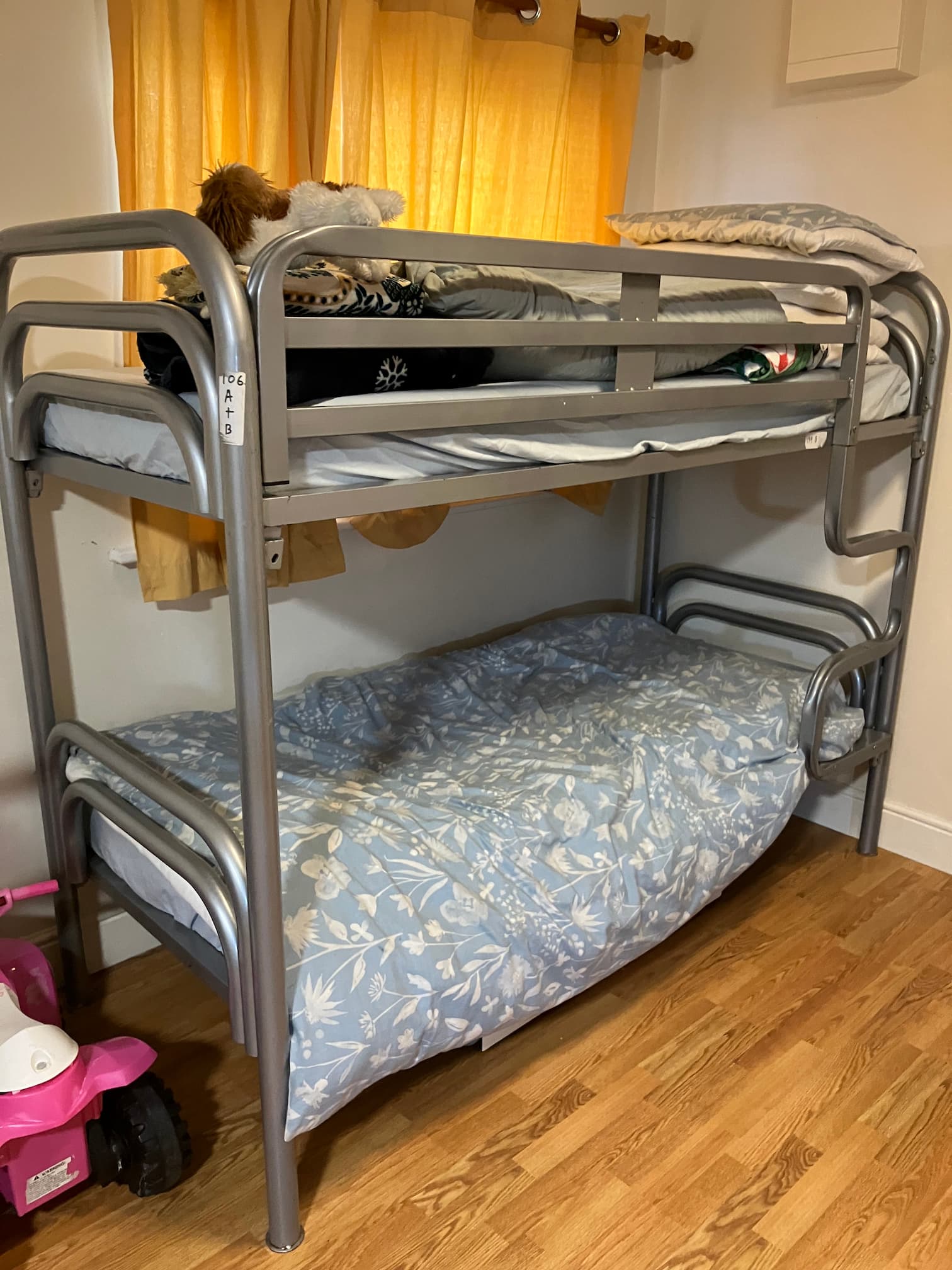 Bedroom in an accommodation centre with bunk beds showing basic living facilities for residents
