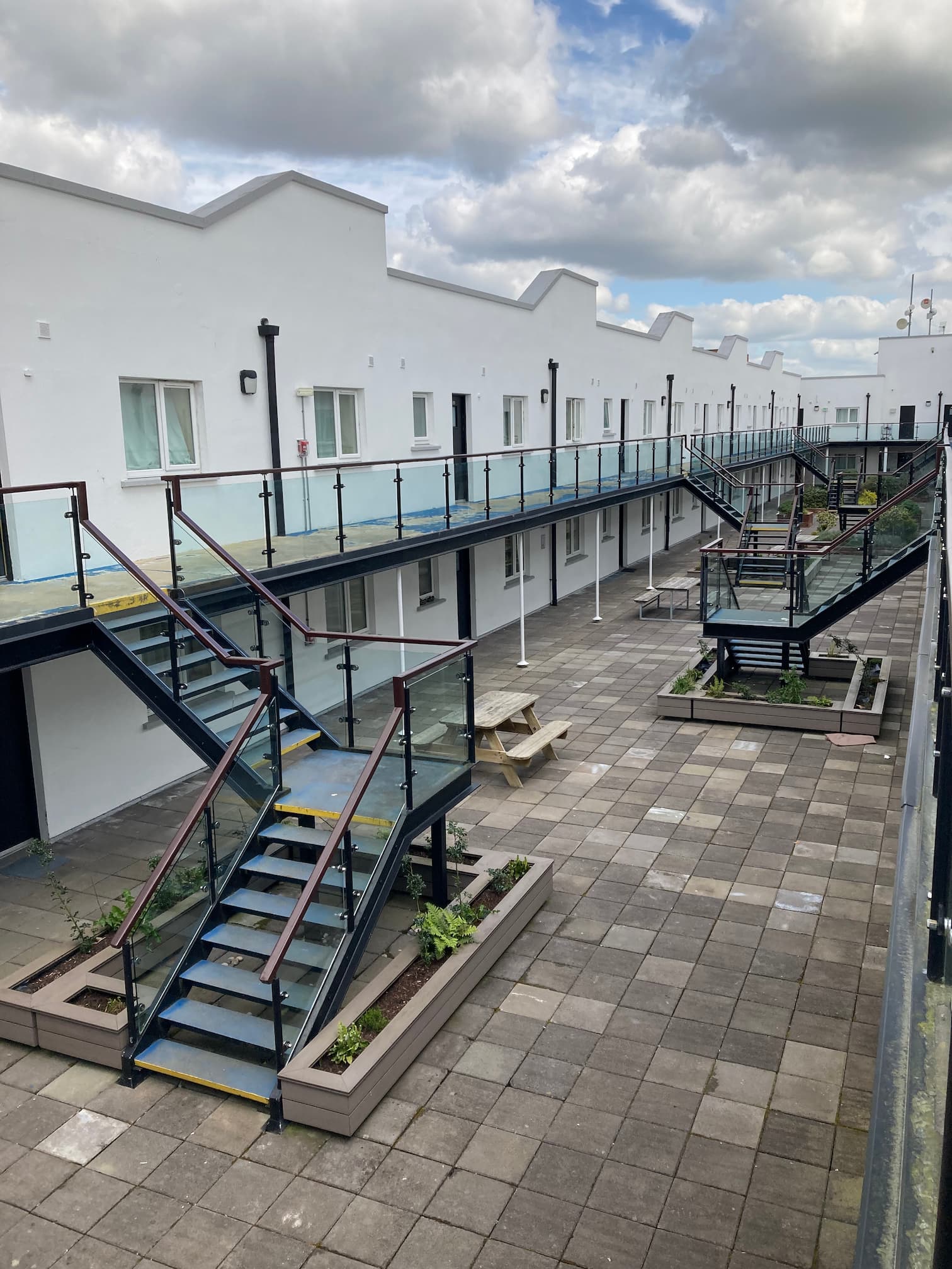 Shared accommodation centre buildings and walkways showing residential facilities managed for residents