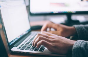 Person typing on a laptop